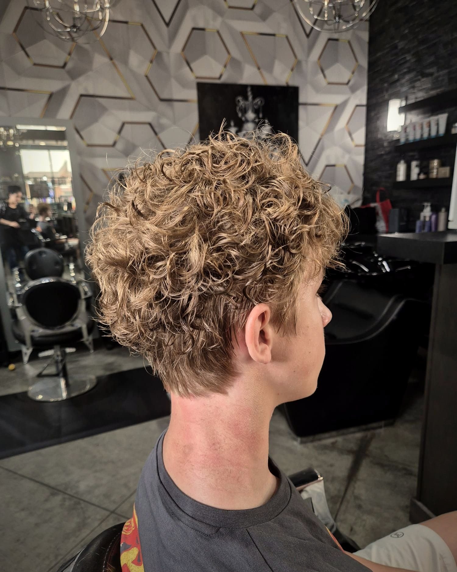 Curly textured top with a taper, BC Barber Shop