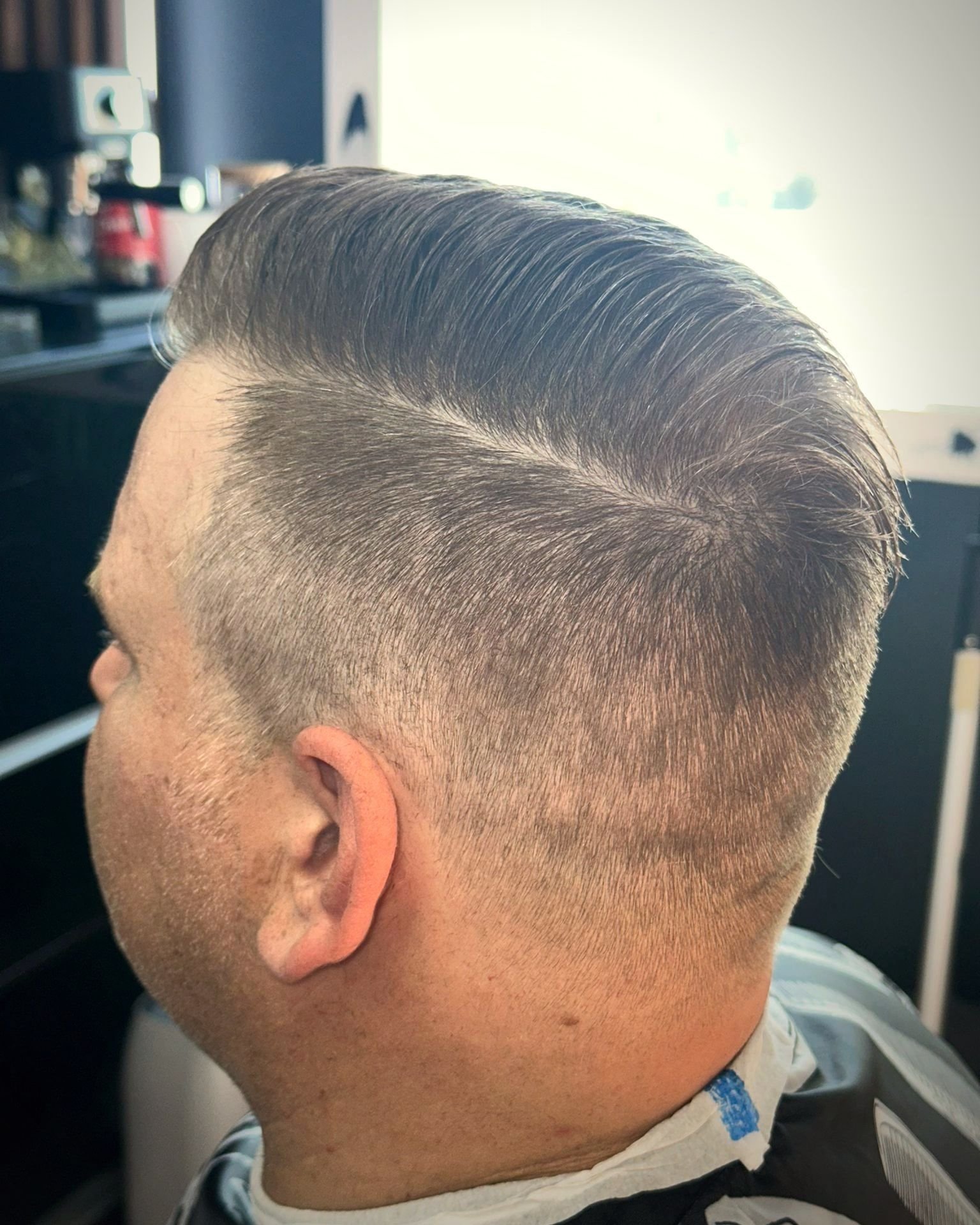 Side part with a low fade, BC Barber Shop
