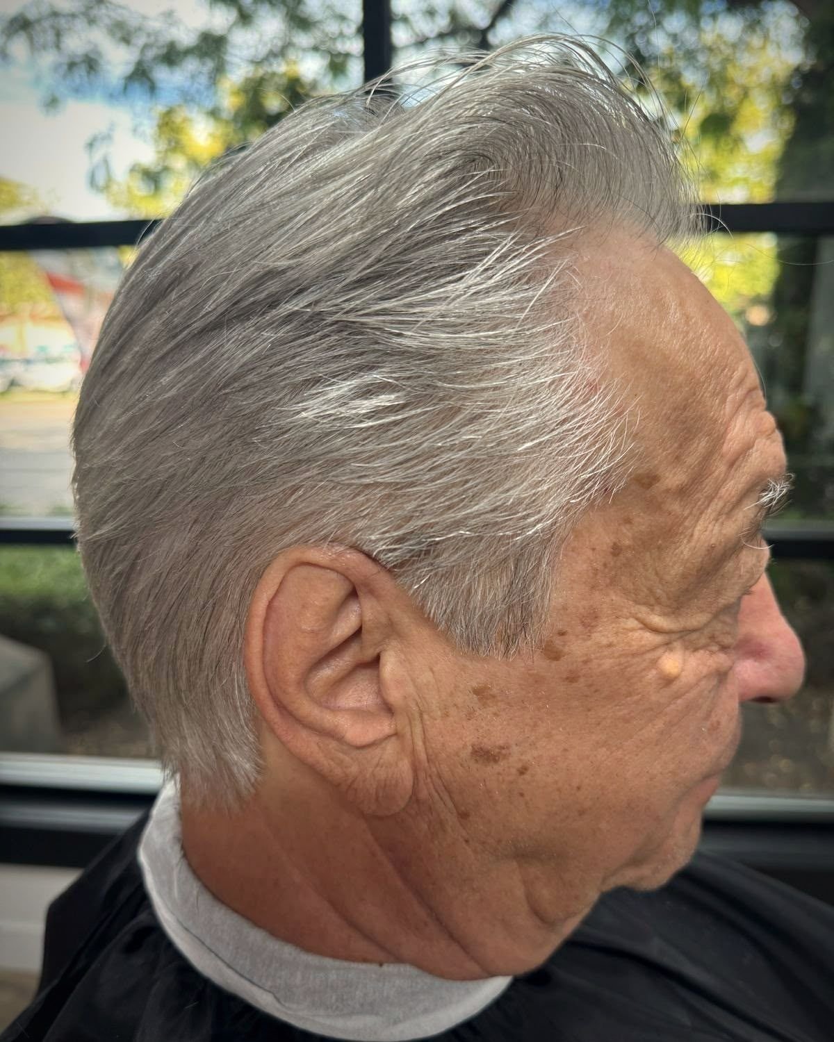 Classic swept back cut on silver hair, BC Barber Shop