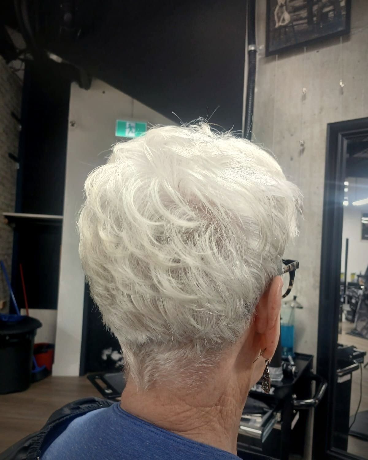 Women's short pixie cut on white hair, BC Barber Shop